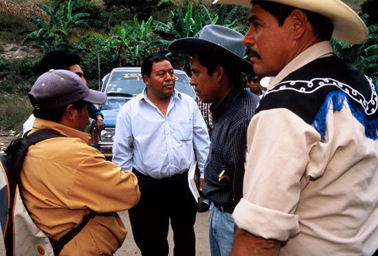 Photo - Men Discuss Project